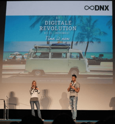 marcus meurer and felicia hargarten on stage dnx conference